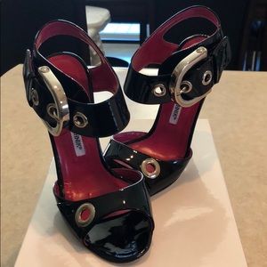 Manolo Blahnik “Koyu” Black Patent Sandals